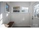 Bright sunroom with wood bench and beadboard walls at 143 Hallman St, Cherryville, NC 28021