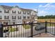 Townhome community view from a balcony, showing homes and parking at 1725 Aspire St, Charlotte, NC 28262