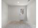 Unfinished basement with a door leading outside at 1725 Aspire St, Charlotte, NC 28262