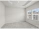 Spacious bedroom with neutral walls and carpeted floors at 1725 Aspire St, Charlotte, NC 28262