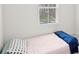 Small bedroom with twin bed and window overlooking the neighborhood at 1725 Aspire St, Charlotte, NC 28262