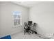 Bright bedroom with window, workspace, and yoga mat at 1725 Aspire St, Charlotte, NC 28262