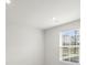 Well-lit bedroom featuring a window with blinds at 1725 Aspire St, Charlotte, NC 28262