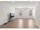 Spacious common area with hardwood floors and large windows at 1725 Aspire St, Charlotte, NC 28262