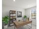 Home office featuring a desk and built-in shelving at 1725 Aspire St, Charlotte, NC 28262