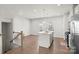 Modern kitchen with island, granite countertops, and stainless steel appliances at 1725 Aspire St, Charlotte, NC 28262