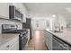 Modern kitchen with stainless steel appliances and granite countertops at 1725 Aspire St, Charlotte, NC 28262