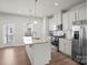 Modern kitchen with island, granite countertops, and stainless steel appliances at 1725 Aspire St, Charlotte, NC 28262