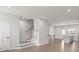 Bright living room with hardwood floors and staircase at 1725 Aspire St, Charlotte, NC 28262