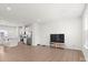 Open living area with kitchen and hardwood floors at 1725 Aspire St, Charlotte, NC 28262