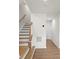 Modern staircase with wooden steps and railing at 1725 Aspire St, Charlotte, NC 28262
