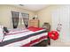 Cozy bedroom with striped bedding and a dresser, offering a tranquil atmosphere at 2027 Killarney Pl, Charlotte, NC 28262