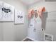 Laundry room with shelving, dog items, and artistic wall decor at 2476 Trollinger Dr, Catawba, NC 28609