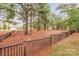 Fenced dog park with benches under shady pine trees at 3045 Bronwood Pl, Lancaster, SC 29720