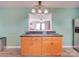 Island kitchen with granite countertops and wood cabinets at 313 Holt Rd, Albemarle, NC 28001