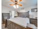 Spacious main bedroom with large bed, ceiling fan and dresser at 313 Holt Rd, Albemarle, NC 28001