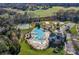 Community pool with lap lanes, a water slide, lounge chairs, and a clubhouse at 3611 Antrim Pl, Kannapolis, NC 28081