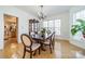 Formal dining room with hardwood floors, a large table, and access to the kitchen at 3712 Alden St, Indian Trail, NC 28079