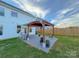 Cozy patio with pergola, chairs and grill at 5124 Hucks Rd, Charlotte, NC 28269