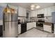 Updated kitchen featuring white cabinets and a granite backsplash at 625 9Th Sw St, Hickory, NC 28602