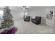 Spacious bonus room with two recliners and a Christmas tree at 8411 Washoe Pine Ln, Charlotte, NC 28215