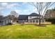 Large backyard with a deck, detached garage and shed at 8823 Dartmoor Pl, Mint Hill, NC 28227