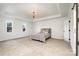 Main bedroom with tray ceiling and carpeted floor at 8823 Dartmoor Pl, Mint Hill, NC 28227