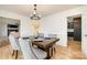 Formal dining room with hardwood floors and view into living room at 8823 Dartmoor Pl, Mint Hill, NC 28227