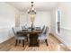 Formal dining room with wood table and gray chairs at 8823 Dartmoor Pl, Mint Hill, NC 28227