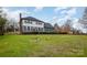 Two-story house with gray siding, multiple windows, and a landscaped lawn at 8823 Dartmoor Pl, Mint Hill, NC 28227