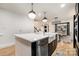 Modern kitchen with island, stainless steel appliances, and white quartz countertops at 8823 Dartmoor Pl, Mint Hill, NC 28227