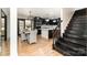 Modern kitchen with island, stainless steel appliances, and dining area at 8823 Dartmoor Pl, Mint Hill, NC 28227