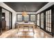 Sunlit office space, featuring a wooden desk and access to a back deck at 8823 Dartmoor Pl, Mint Hill, NC 28227