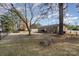 Fenced backyard with mature trees and side yard view at 906 S Cherry Rd, Rock Hill, SC 29732