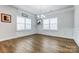 Bright dining room with hardwood floors and elegant chandelier at 11808 Glenwood Dr, Locust, NC 28097