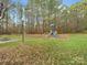 Community playground with swings, slides, and climbing structures at 151 Paseo Dr, Mooresville, NC 28117