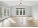 Sunroom with vaulted ceiling and French doors at 151 Paseo Dr, Mooresville, NC 28117