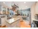 Well-equipped kitchen with island and copper pot rack at 15215 Timberview Ln, Huntersville, NC 28078