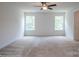 Spacious bedroom with carpet flooring and two large windows at 2011 Cedar Falls Dr # 71, Waxhaw, NC 28173