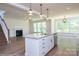 Kitchen island with granite countertops and stainless steel appliances at 2011 Cedar Falls Dr # 71, Waxhaw, NC 28173