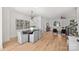 Open concept dining area with hardwood floors and modern light fixture at 2019 Thurmond Pl # 13, Charlotte, NC 28205