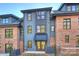 Gray and brick townhome exterior with a private patio at 2019 Thurmond Pl # 13, Charlotte, NC 28205