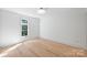 Spacious bedroom with hardwood floors and large window at 2023 Thurmond Pl # 14, Charlotte, NC 28205