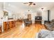 Spacious living room with hardwood floors, wood burning stove, and comfortable seating at 210 Round Tuit Ln, Mt Ulla, NC 28125