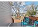 Backyard with a wooden deck, picnic table, and storage shed at 212 Tournament Sw Dr, Concord, NC 28025