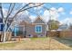 Backyard view showcasing a home with a deck and surrounding fence at 212 Tournament Sw Dr, Concord, NC 28025