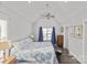 Bright bedroom featuring vaulted ceilings, hardwood floors, and ample natural light at 212 Tournament Sw Dr, Concord, NC 28025