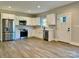 Modern kitchen with stainless steel appliances and white cabinets at 213 Seigle St, Lowell, NC 28098