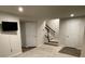 Finished basement with carpeted floors and stairs leading to the main level at 2133 Tupelo Grove Ln, Gastonia, NC 28054