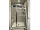 Clean and bright bathroom with a glass-enclosed shower and tiled walls at 2133 Tupelo Grove Ln, Gastonia, NC 28054